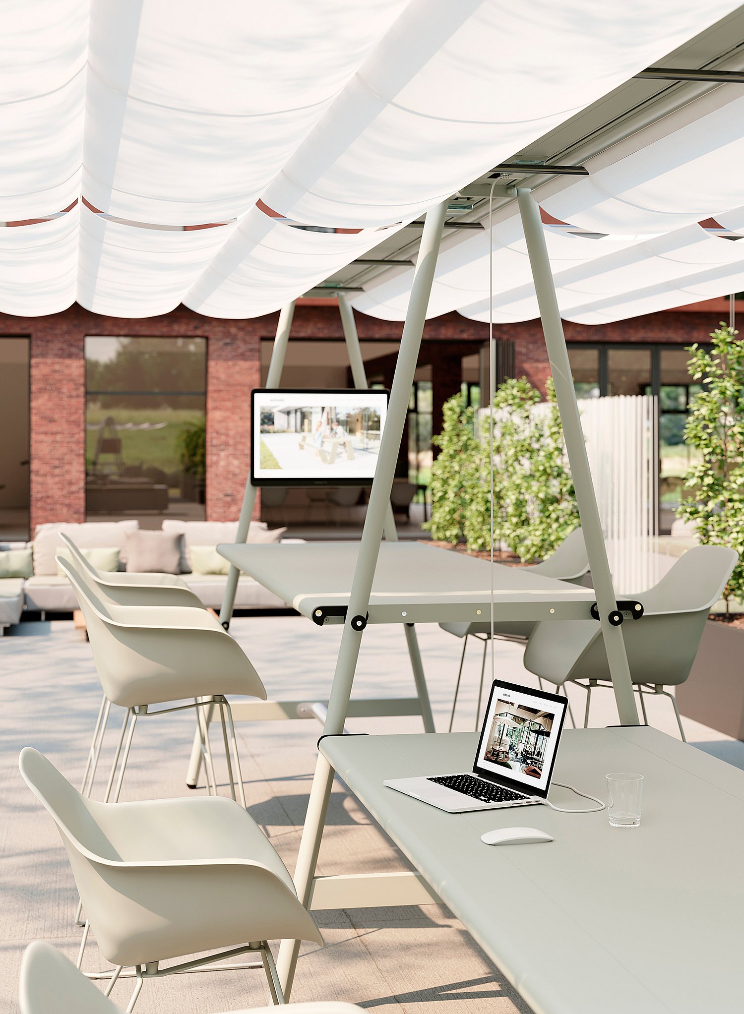 White AMAi tables with chairs, laptops, and overhead shade panels arranged on a sunny outdoor terrace for flexible working.