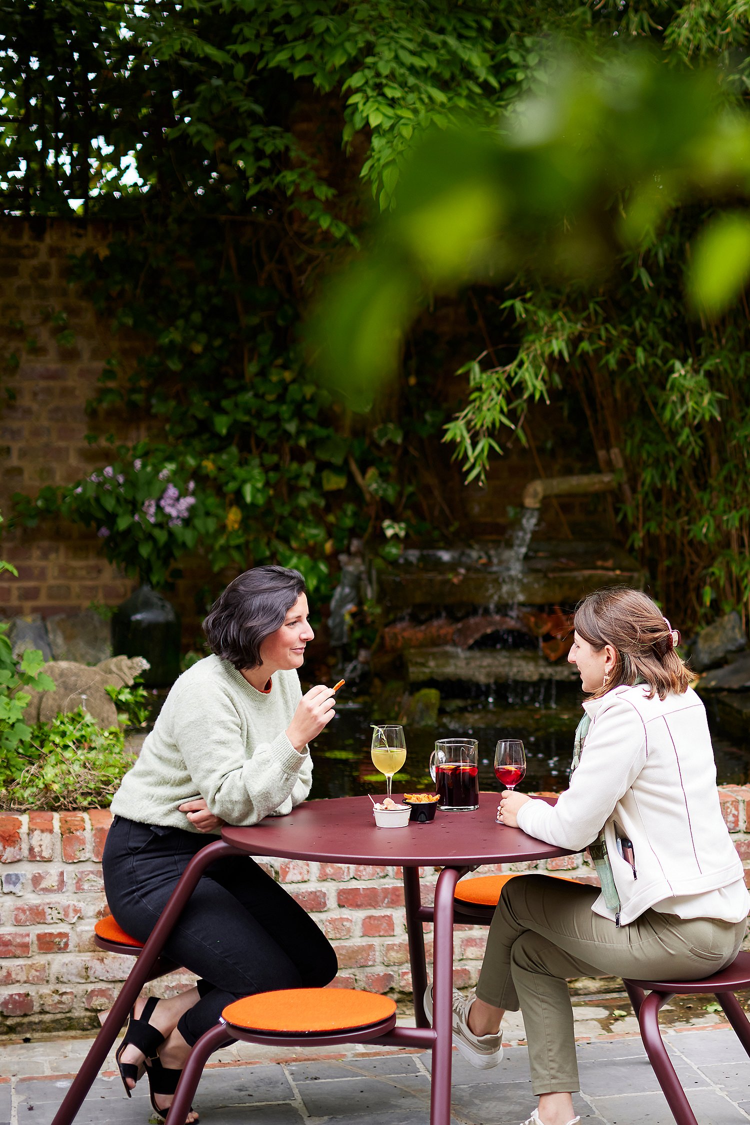 Guests tell stories to colorful virus tables in a comprehensive courtyard