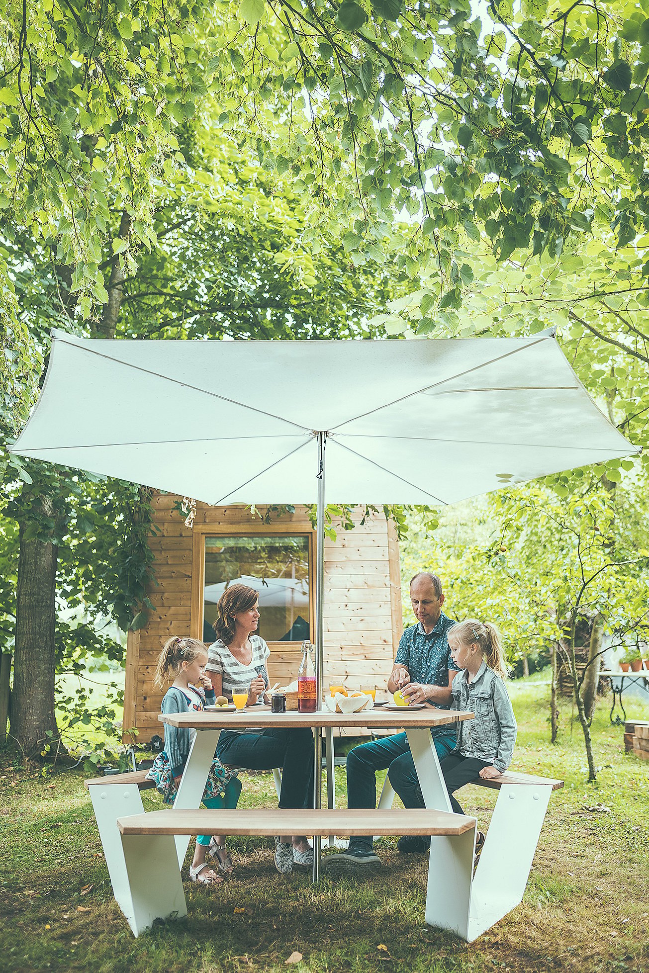 People gathered around the anker for food and drinks accompanied by the children.