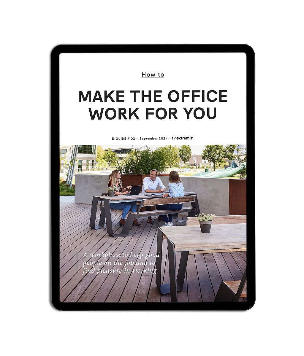 Tablet mockup displaying the cover of the e-book How to Make the Office Work for You, featuring three coworkers seated at an outdoor workplace table on a wooden terrace.