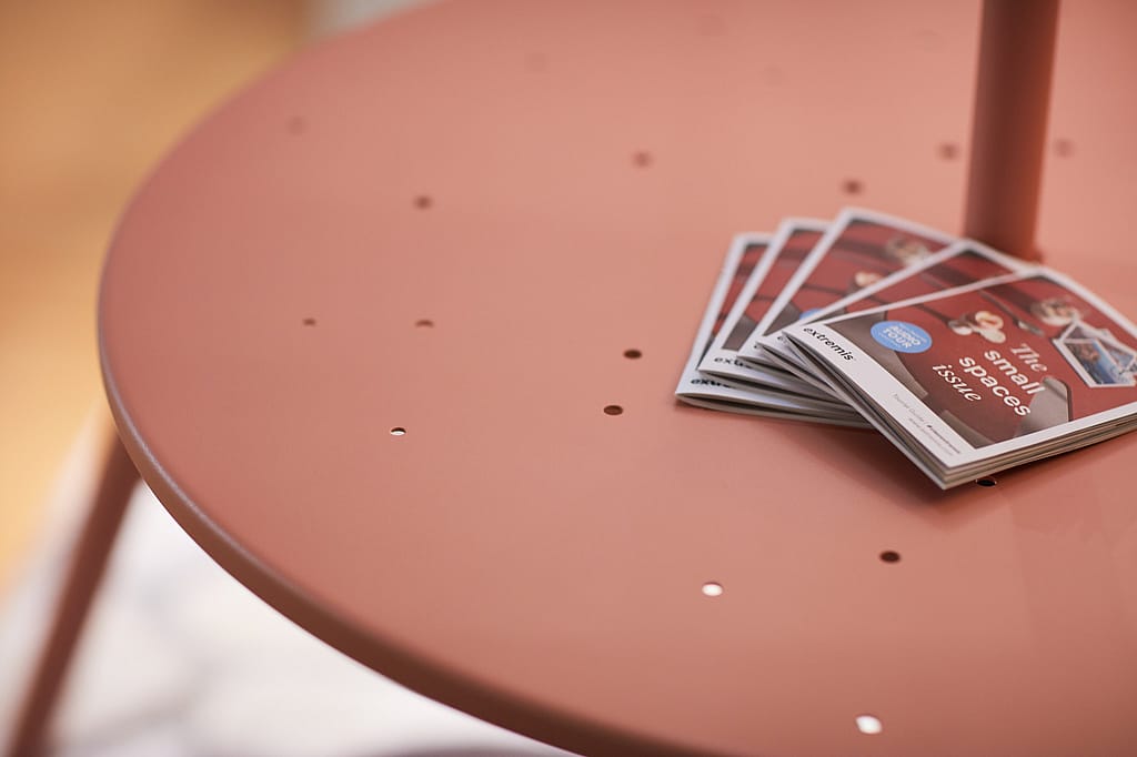 Close up of the virus table with books on top.