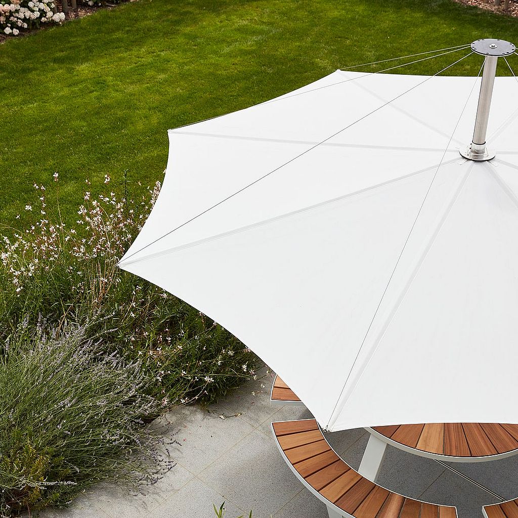 Collection of Extremis parasols and shades presented together, introducing innovative outdoor shade solutions for all seasons.