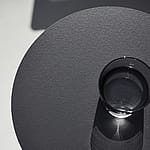 Close-up of an HPL tabletop surface, highlighting the smooth, durable finish used on Extremis outdoor furniture.