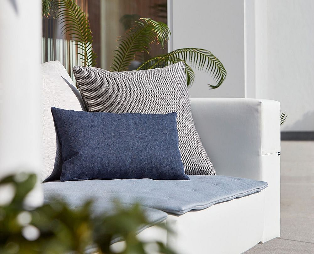 Close-up of outdoor cushions, introducing the care guide for Extremis cushions made with Sunbrella fabric.