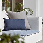 Close-up of outdoor cushions, introducing the care guide for Extremis cushions made with Sunbrella fabric.