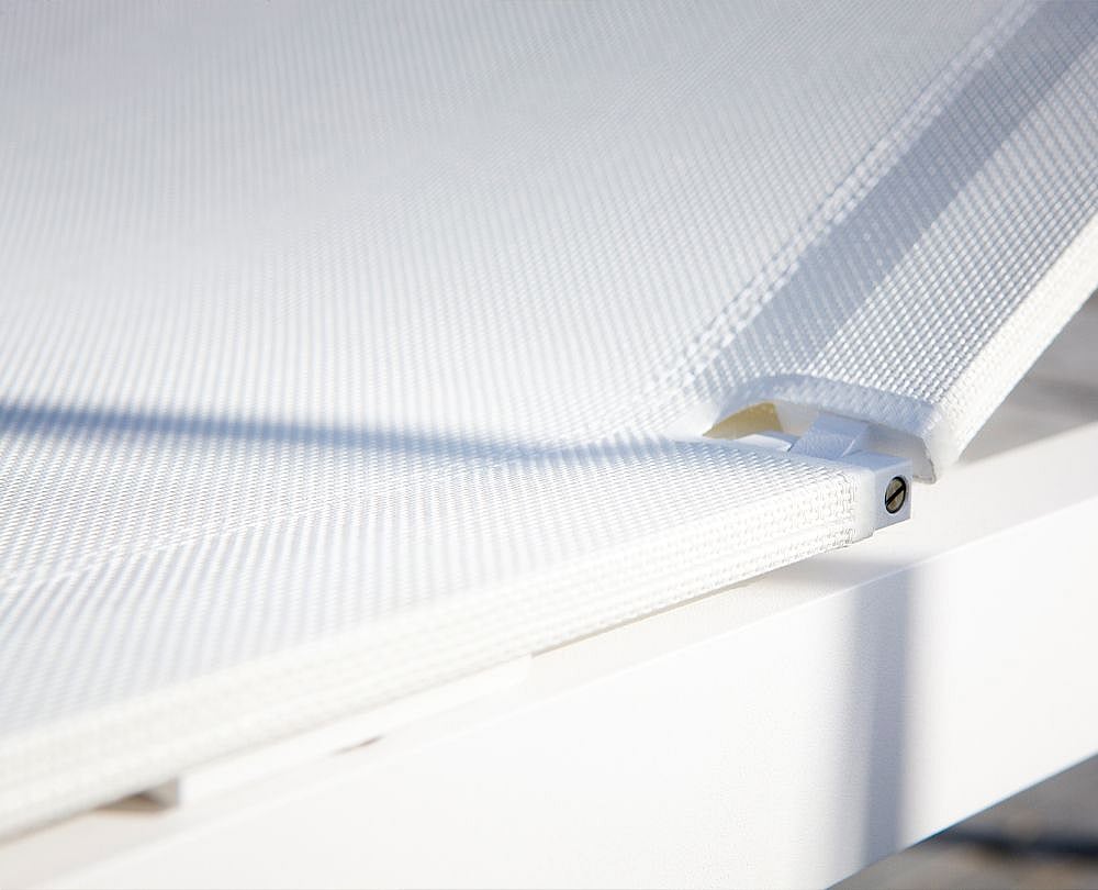Close-up of the Sol+Luna mesh seat surface, highlighting the taut open-weave Batyline material used on the outdoor sunbed.