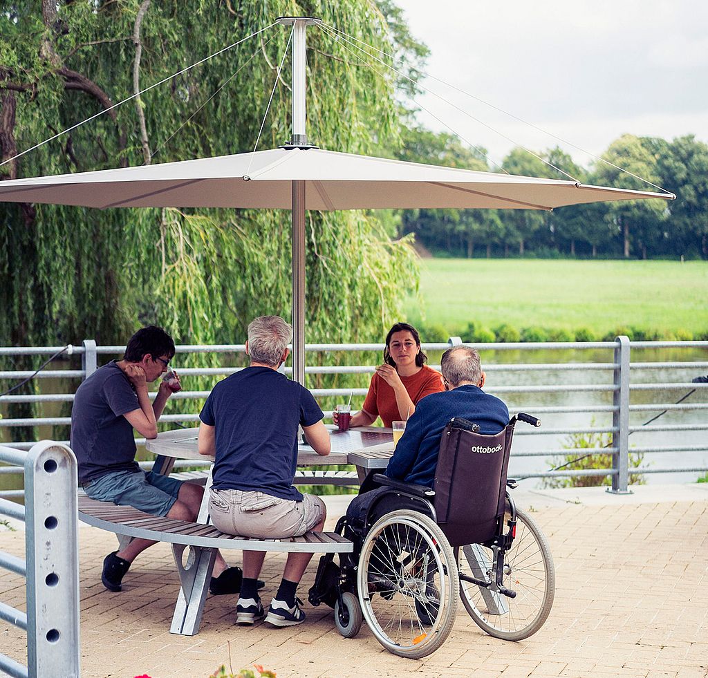 Overview image introducing wheelchair-accessible Extremis tables and picnic benches designed for inclusive use.