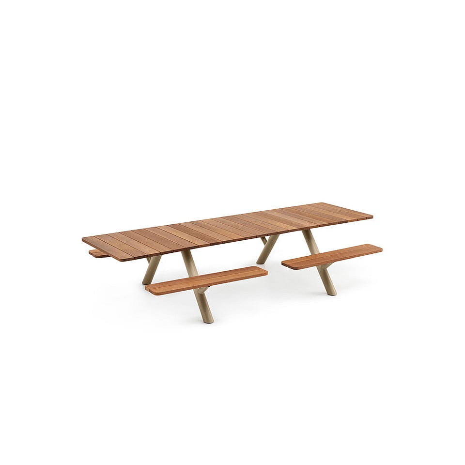 Studio-style view of the Panigiri table with long matching benches, highlighting its clean lines and aligned bench seating.