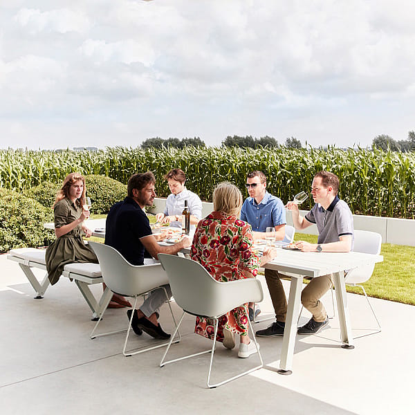 Long Marina table shown as a flexible communal table for anything from a family of four to a large guest list, designed to encourage easy movement and conversation.