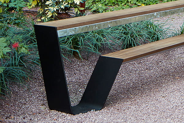 Hopper bench with wooden seat and tabletop on a black steel frame