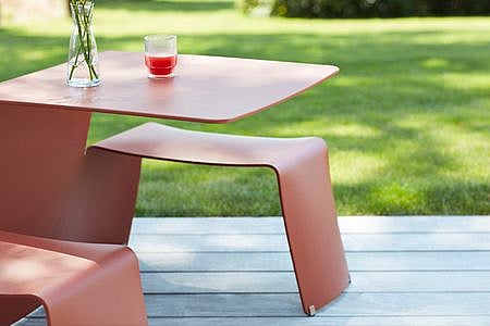 Picnik table with a drink on it.