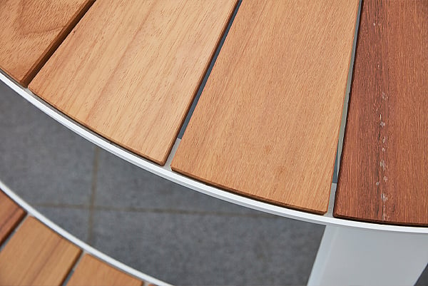 Close-up of wooden Pantagruel picnic benches and tabletop edge