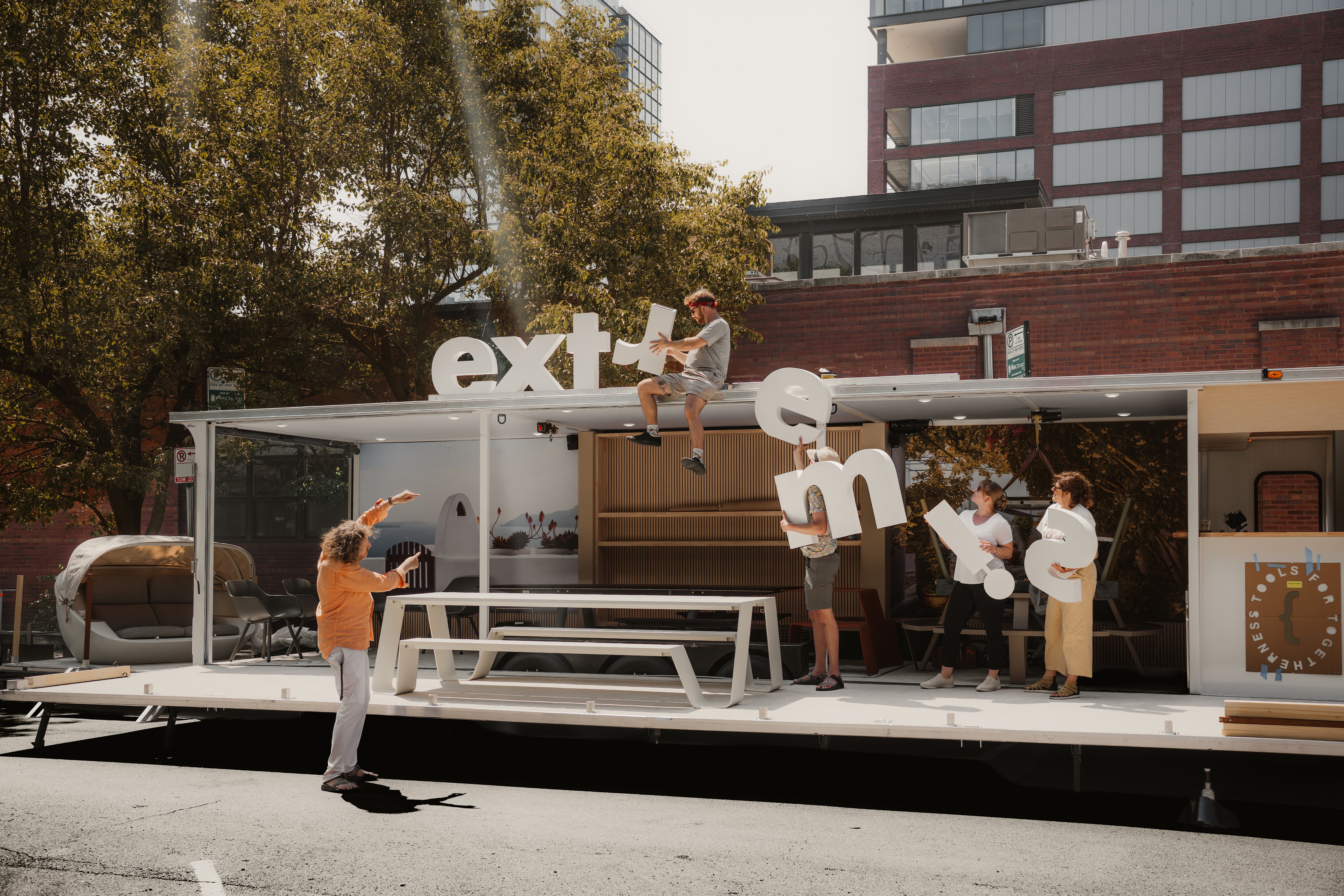 Group of people setting up traveling showroom
