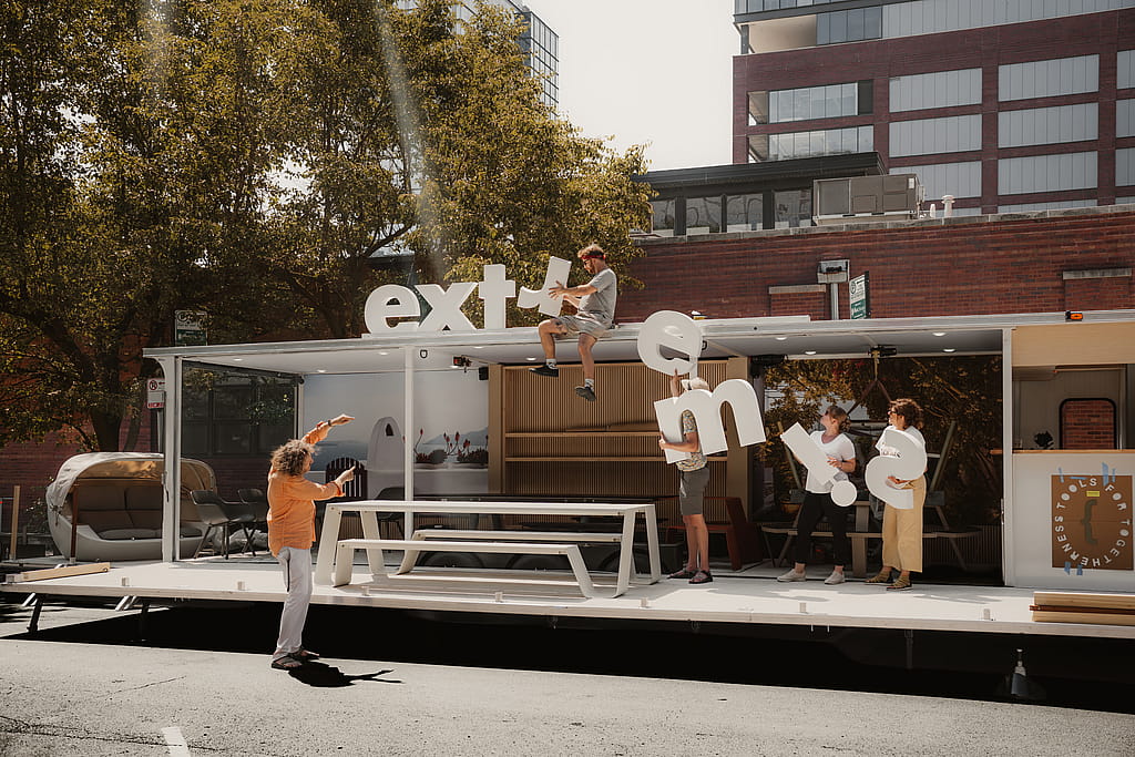 Group of people setting up traveling showroom