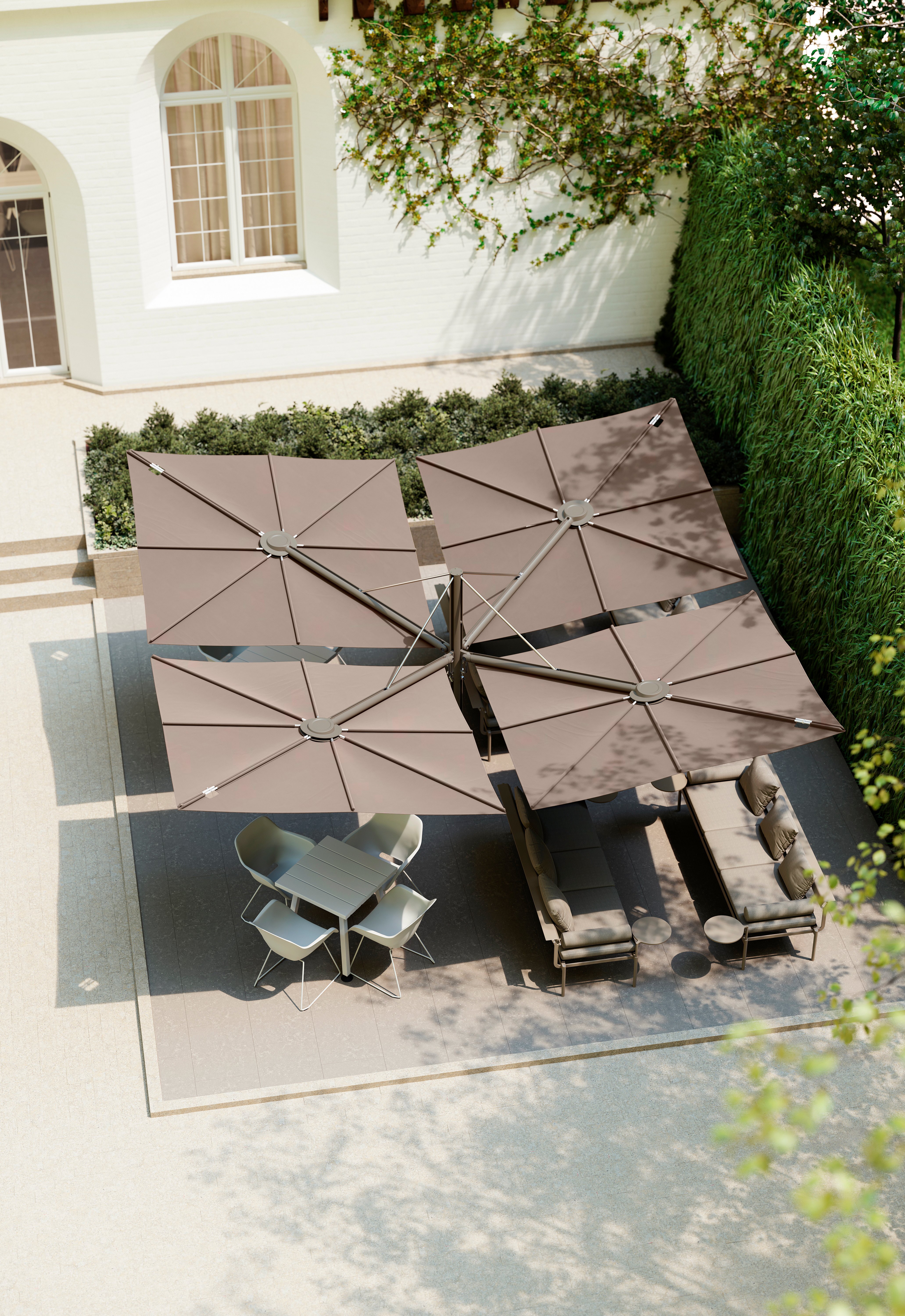 Top view of four Sensu Quattro canopies shading an outdoor restaurant terrace