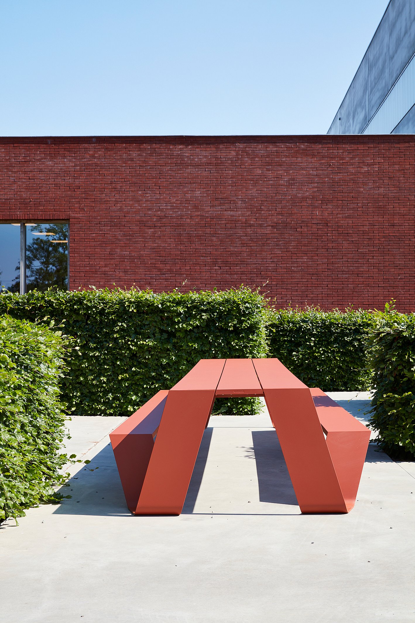 Copper brown Hopper AA picnic table on a modern office terrace