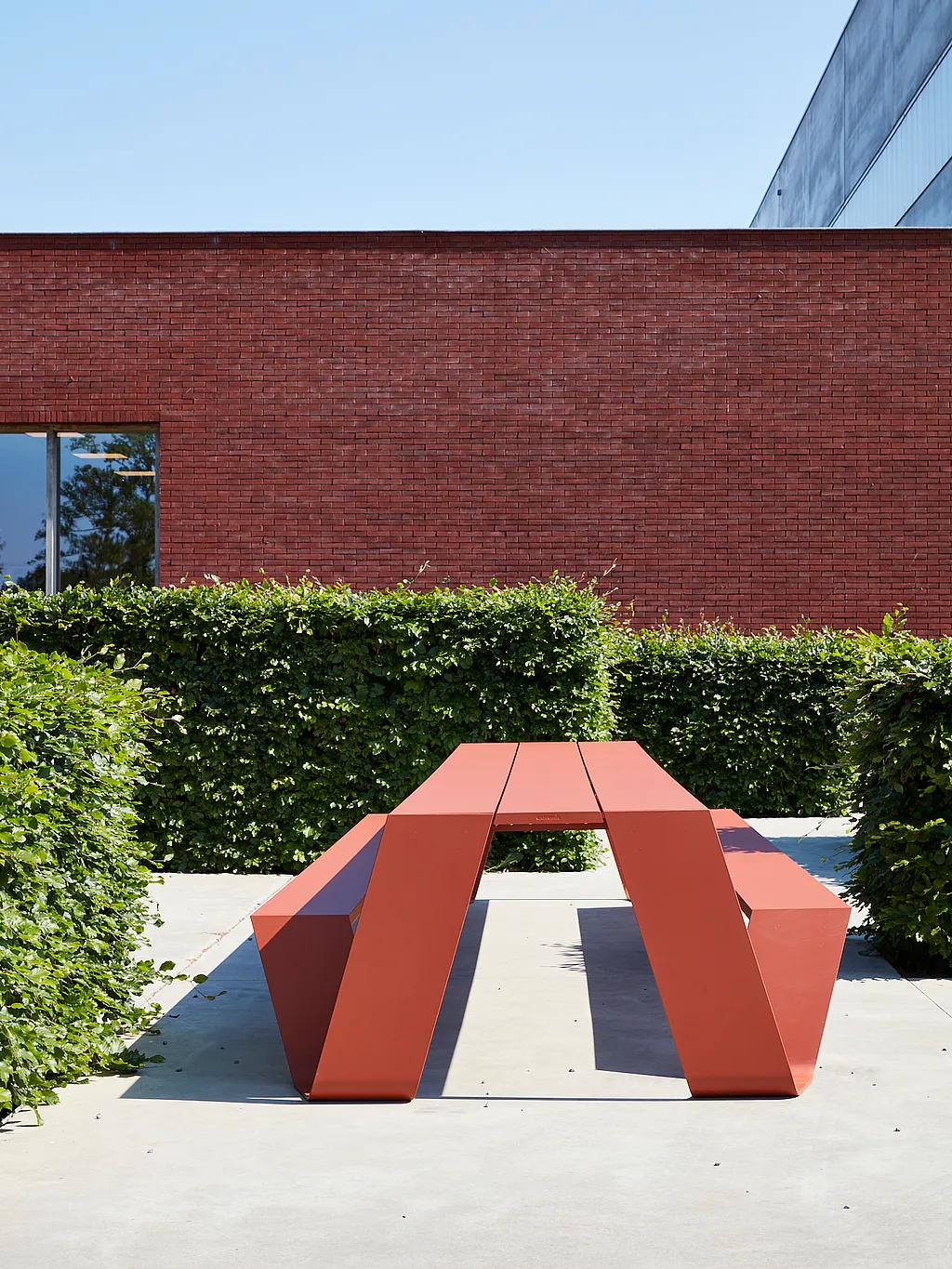 Copper brown Hopper AA picnic table on a modern office terrace