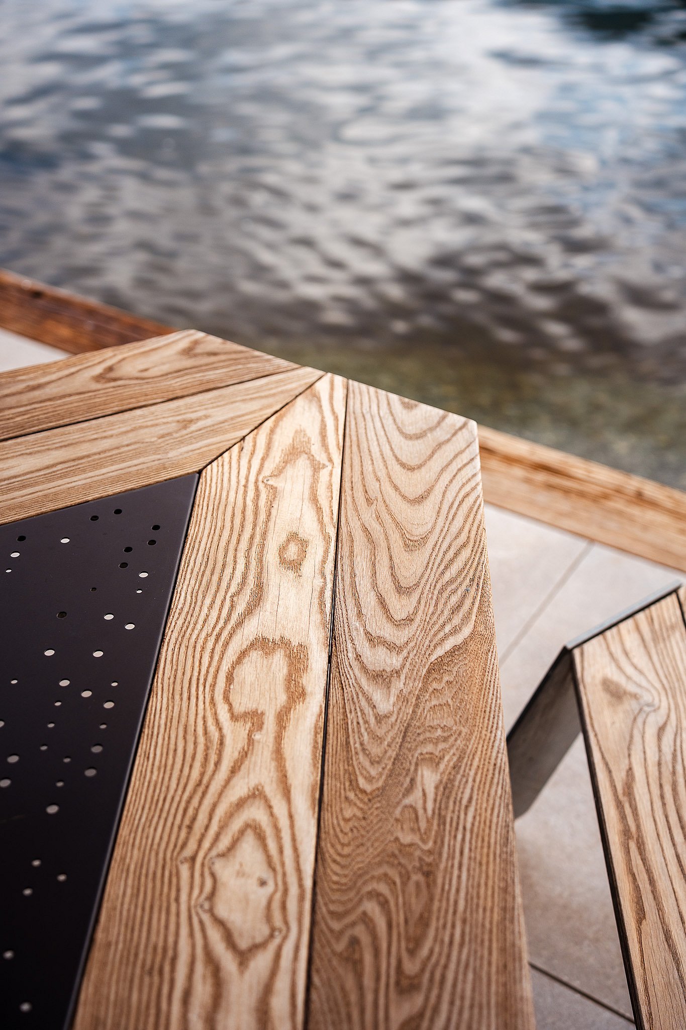 Close-up of the thermally treated wood and galvanized steel of the Extremis Anker picnic table
