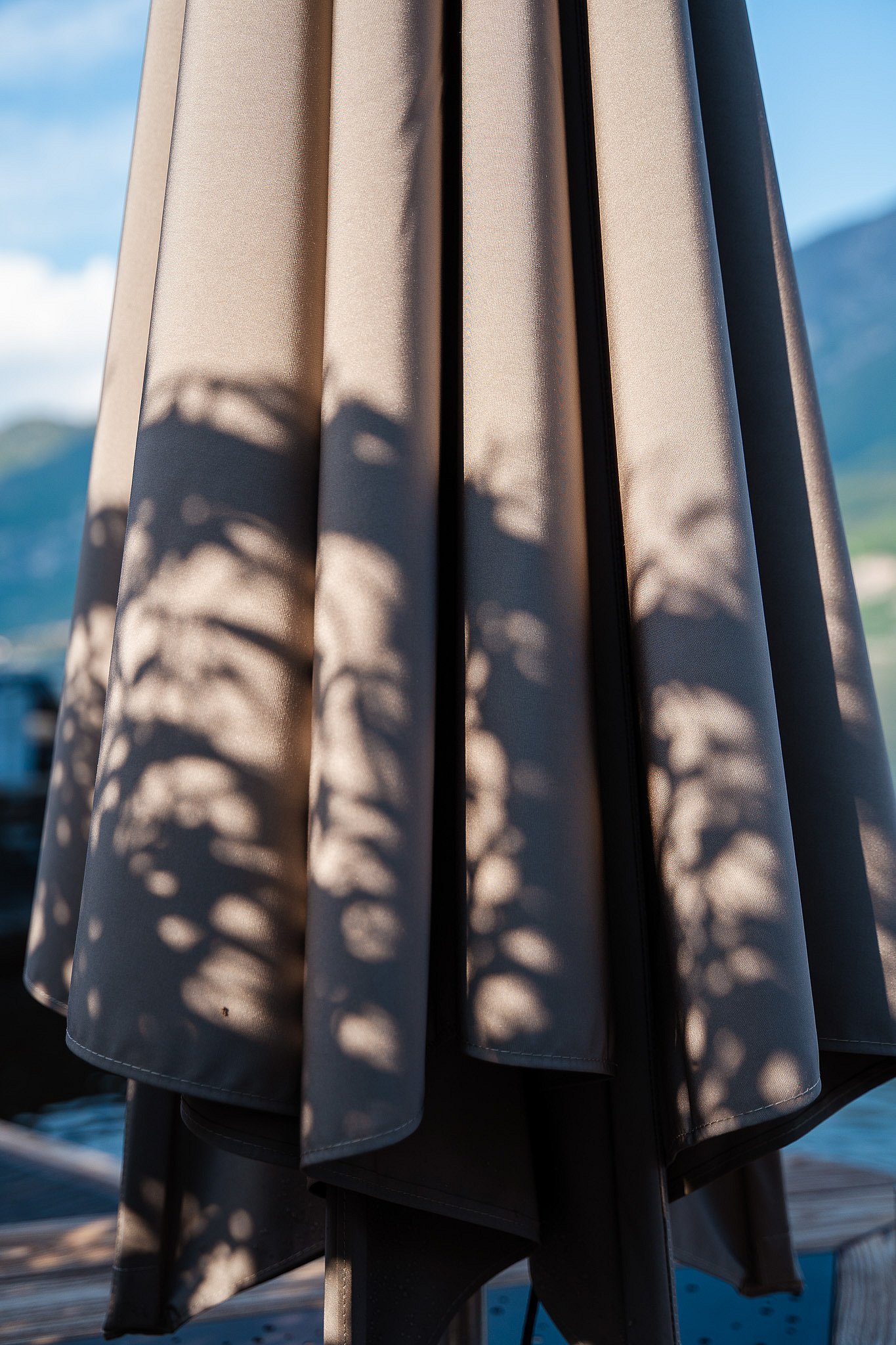 Close-up of the folded taupe canvas of the Extremis Inumbrina shade