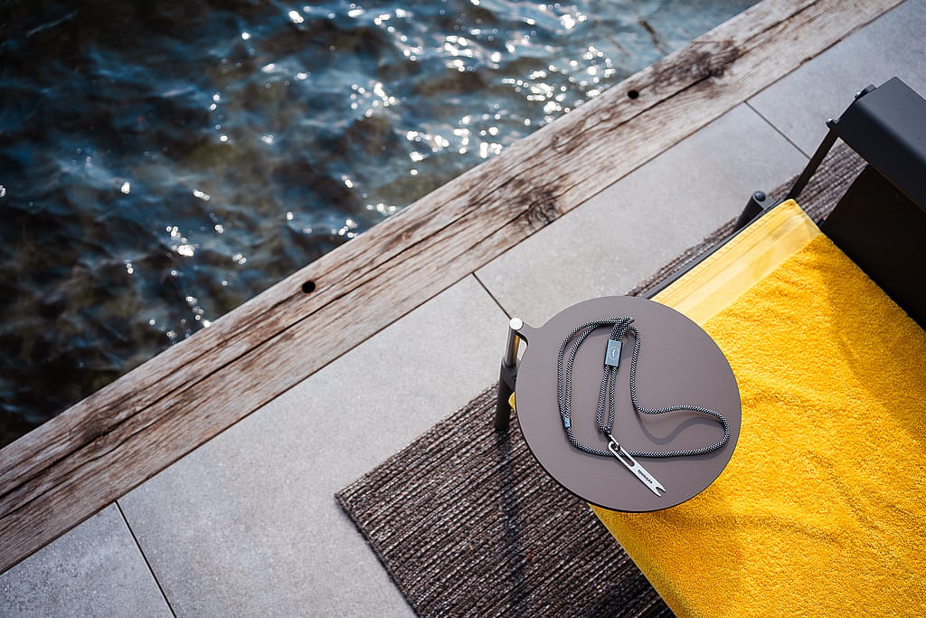 Sol+Luna tapa table plugged into the Extremis Sol+Luna with an Extremis fry fork on it, beside Lake Como