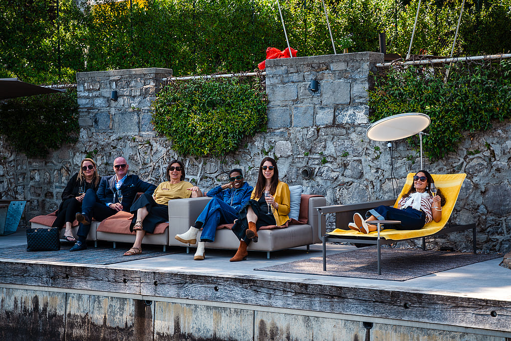 Evening gathering on Extremis Walrus and Sol+Luna furniture along Lake Como